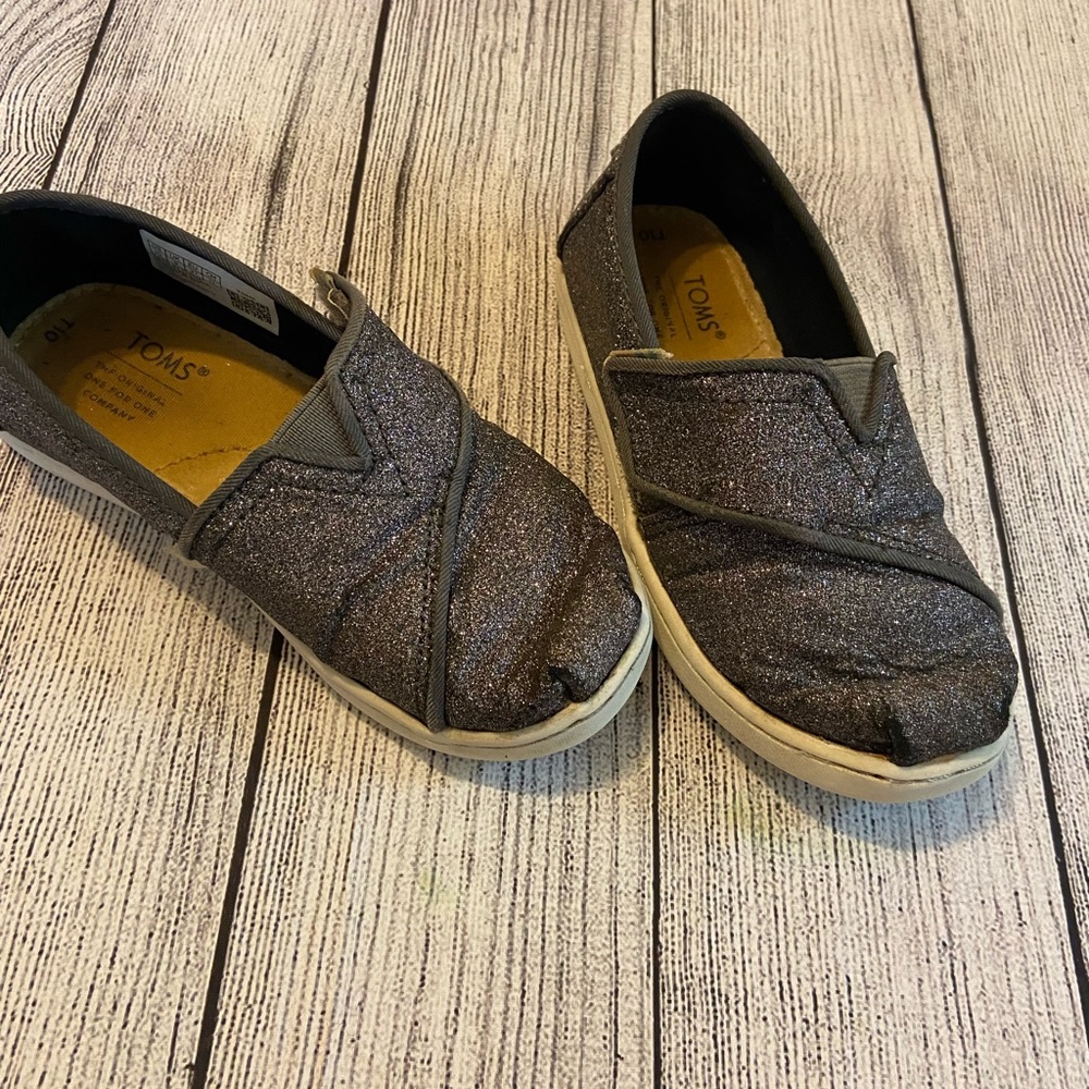 Tom’s black sparkle shoes